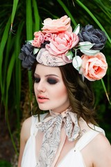 portrait of young sensual woman posing in elegant headwear