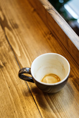 Empty coffee cut at the wooden table