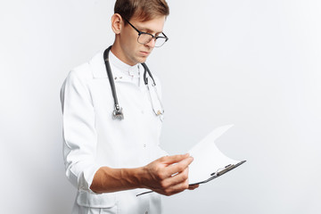 The doctor makes notes in the documents, a young student with a folder in his hands, on a white background