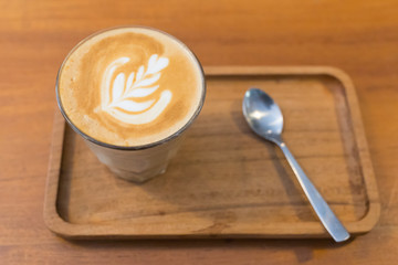 Coffee in an Indonesian cafe on a wooden tray