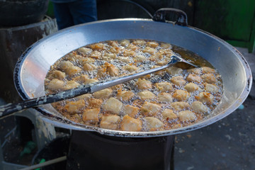 National street food of Indonesia - balls fried in boiling oil
