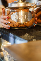  Box with cookies in female hands