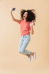 Full length portrait of a cheerful young girl