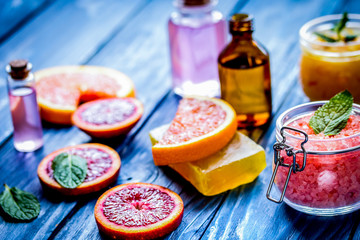 organic cosmetic with citrus on blue background