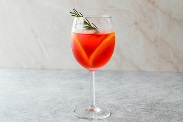 Aperol Spritz Cocktail with Orange Slice, Rosemary and Ice.