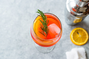 Aperol Spritz Cocktail with Orange Slice, Rosemary and Ice.