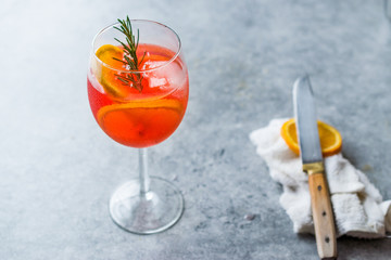 Aperol Spritz Cocktail with Orange Slice, Rosemary and Ice.
