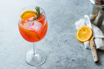 Aperol Spritz Cocktail with Orange Slice, Rosemary and Ice.
