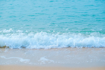 Movement of Soft Blue Ocean beach wave of the sea on the sand