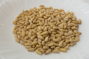 pine nuts on white background