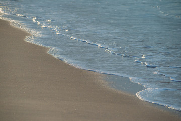 Movement of Soft Blue Ocean beach wave of the sea on the sand
