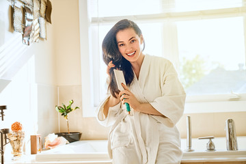 woman is combing hair