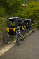 Fototapeta na wymiar Traditional carriages to transport people in Arashiyama, Kyoto, Japan