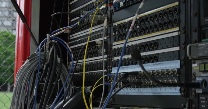 Broadcast cable tv truck with network cables - patch bay signal - slow motion