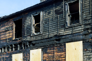 Fire line in front of a destroyed home. burnt house after fire