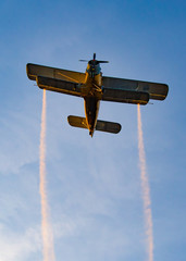 Biplane flying in the sunset