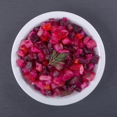 Healthy eating, food, dieting and vegetarian concept - home made vinaigrette salad with vegetables. Top view.