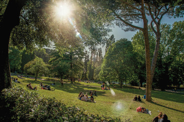 View of people in park of the Villa Borghese on a sunny day in Rome, the incredible city of the...