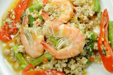 spicy stir fried minced pork and shrimp with basil leaf on plate