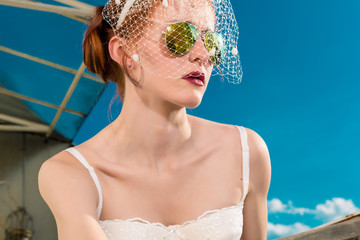 Bride with veil and lingerie for her wedding day
