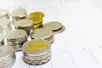 Thai baht coins on the calendar.