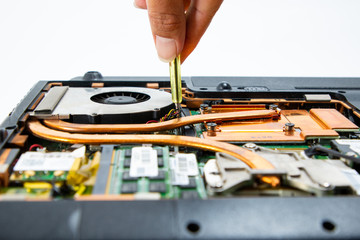Naklejka premium Computer repair technician is repairing the notebook or repair laptop.