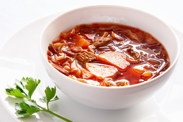 bowl of borscht  with decorated with lovage