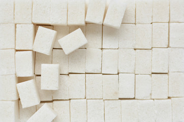 Close-up of white sugar cubes. Viewing from above. Sweet drug