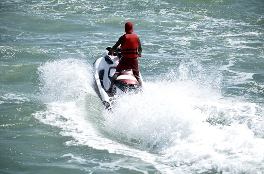 Jet skier running waves on the florida intra-coastal waterway offMiami Beach.