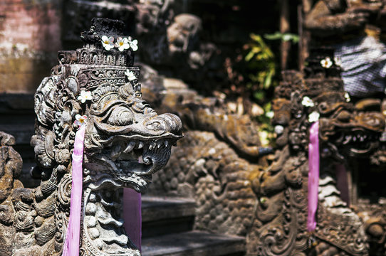 Traditional Balinese stone sculpture art and culture at Bali, Indonesia. Architecture, traveling and religion.