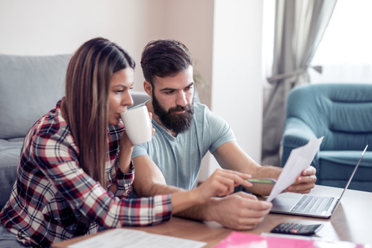 Young Couple Doing Family Finances At Home