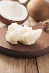 Coconut butter  on dark wooden board. Organic healthy food concept. Beauty and SPA concept.