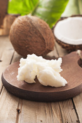 Coconut butter  on dark wooden board. Organic healthy food concept. Beauty and SPA concept.