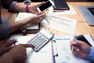 Administrator business man financial inspector and secretary making report, calculating or checking balance.