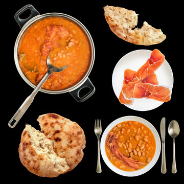 Baked Beans cooked with smoked pork ribs served with Prosciutto slices on porcelain plate and leavened Flatbread isolated on black background