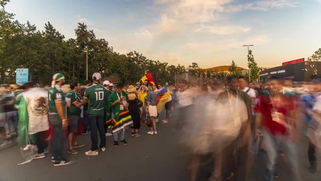 spectators and football fans out of the stadium after the match,time lapse