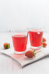 summer drink with strawberry and ice on white background.