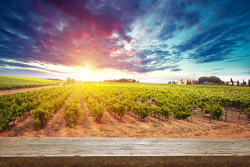 Landscape of Tuscany with desk of yellow wood