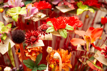 Fototapeta na wymiar Plastic colourful flowers. Background texture.