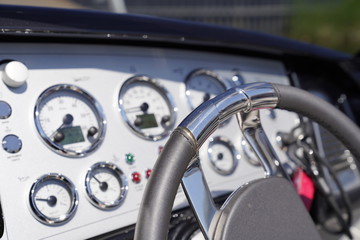 Steering wheel and a cockpit of a luxury motorboat