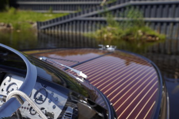 Fototapeta premium Luxury motorboat parked in the water on a sunny day