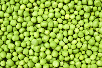 Fresh green peas background texture top view

