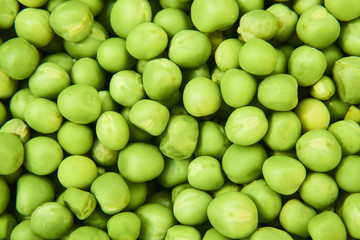 Fresh green peas background texture top view

