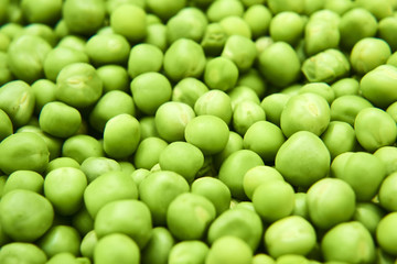 Fresh green peas background texture top view
