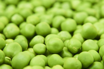 Fresh green peas background texture top view
