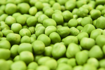 Fresh green peas background texture top view
