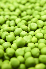 Fresh green peas background texture top view
