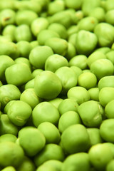 Fresh green peas background texture top view
