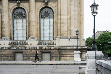 Obraz premium A business woman is walking on the street at Switzerland.
