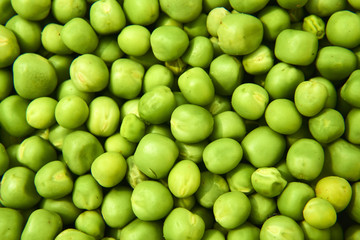 Fresh green peas background texture top view
